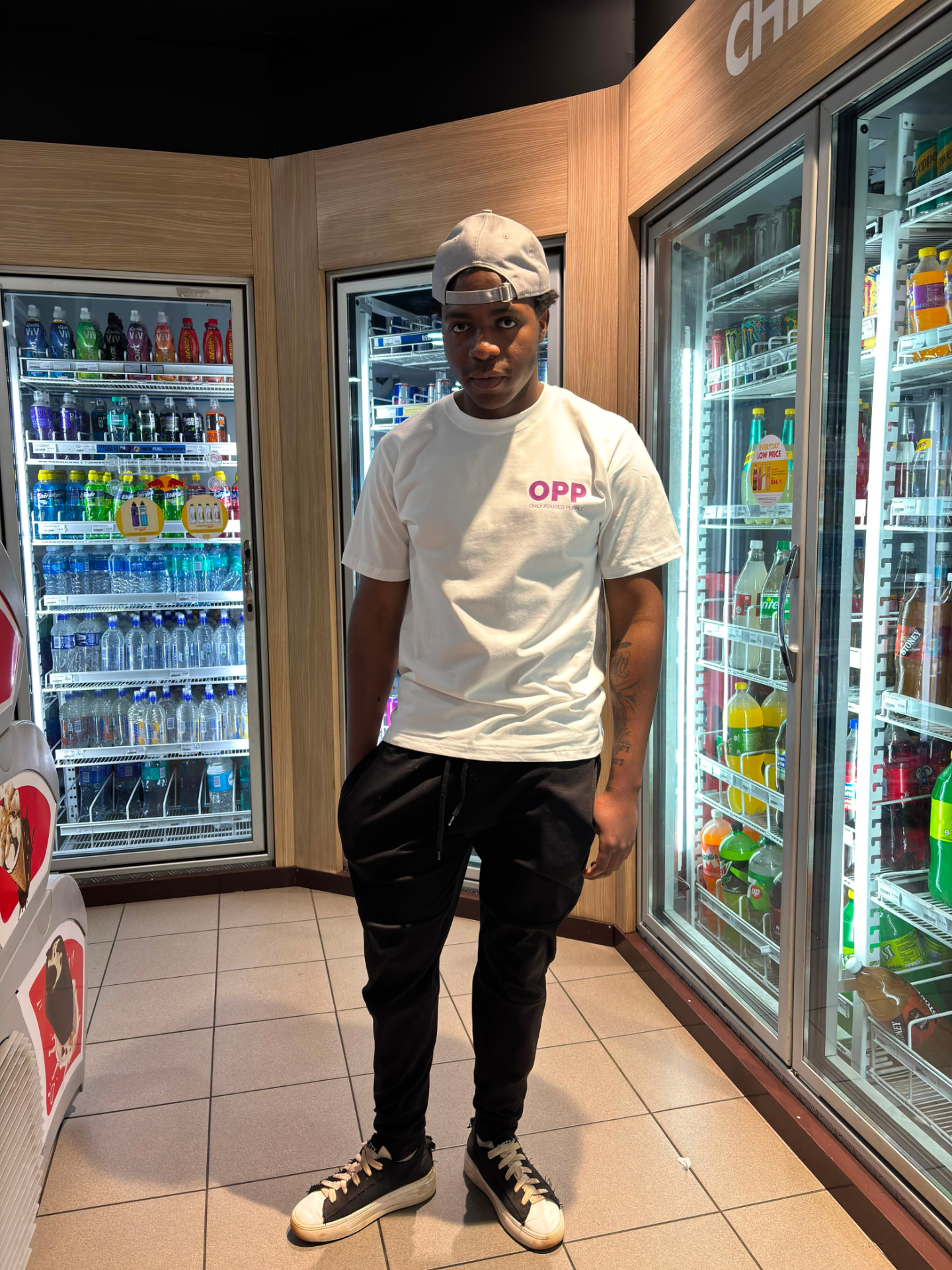 DLS Store — model wearing an Only Poured Purple tee